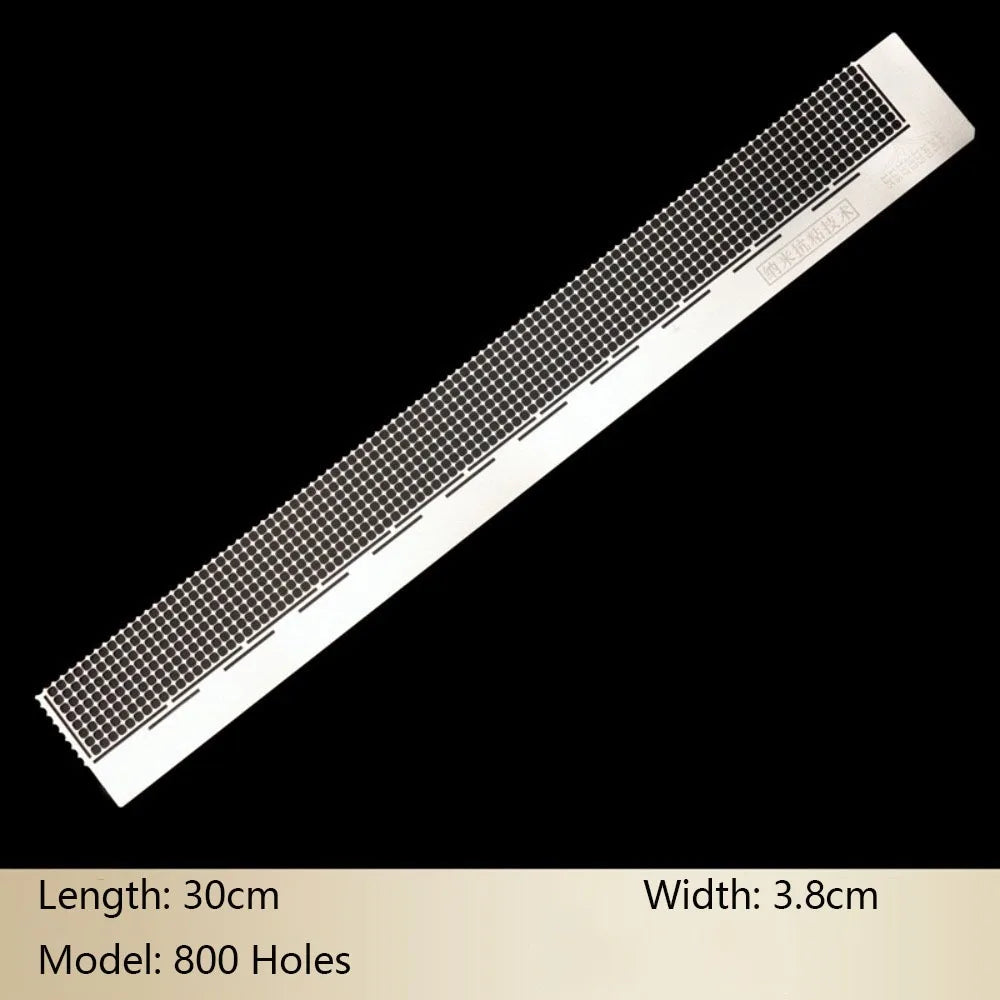 A long, rectangular stainless steel cross ruler with 800 holes used for diamond painting.