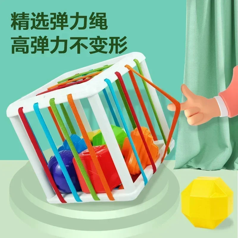White plastic cube with colorful elastic bands for shape sorting and strengthening fingers