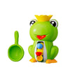 A bright green frog bath toy with a yellow crown, featuring a spoon and colorful balls inside.