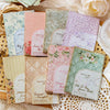 A collection of vintage paper sheets featuring floral and nature patterns for journaling and scrapbooking