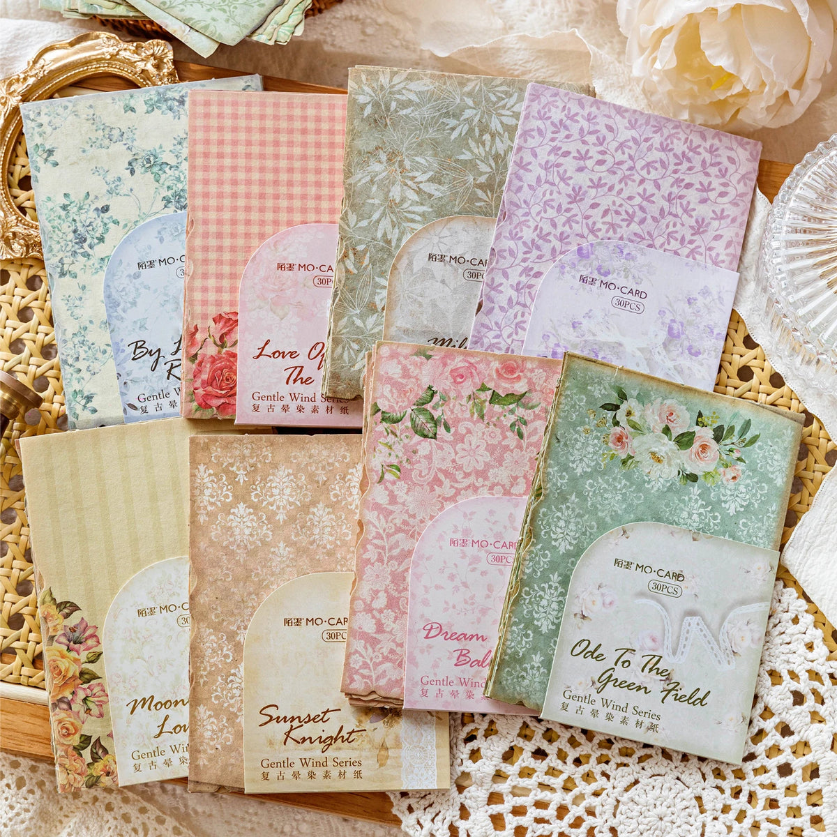 A collection of vintage paper sheets featuring floral and nature patterns for journaling and scrapbooking