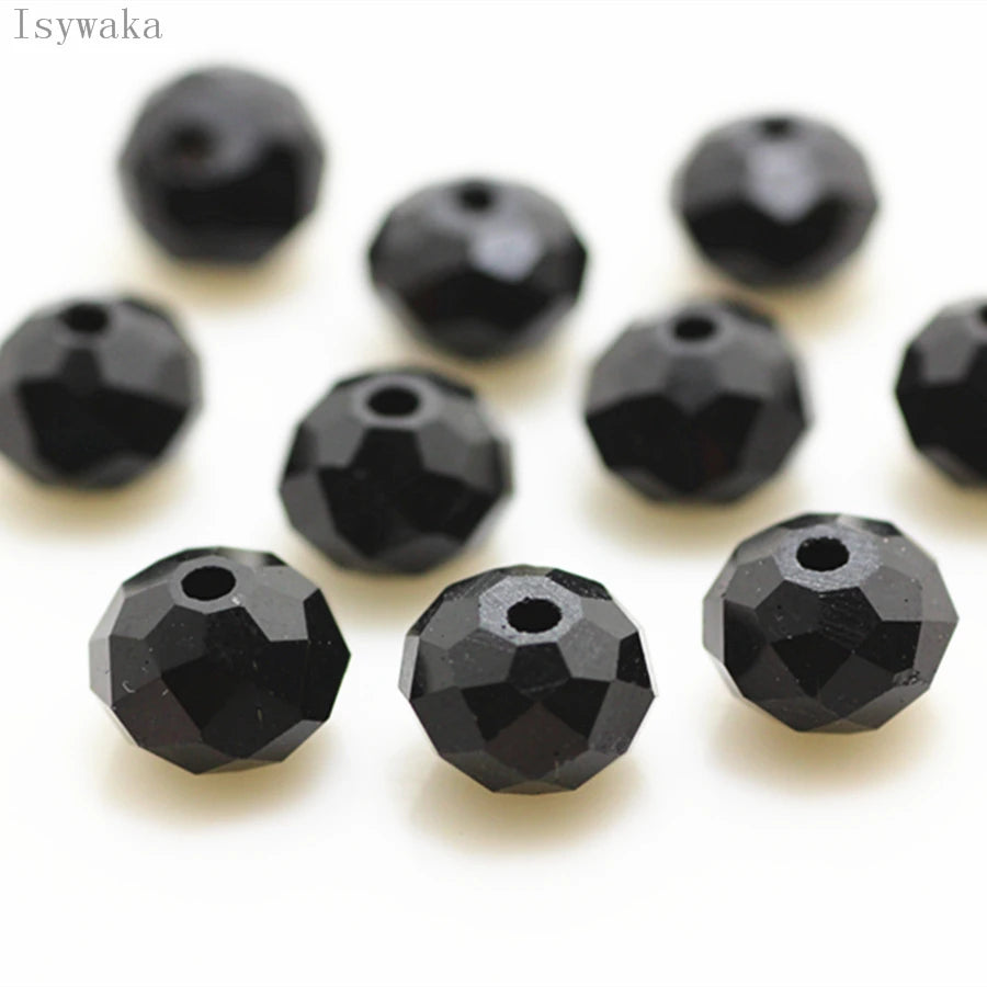 A collection of black, round crystal glass beads used for jewelry making.