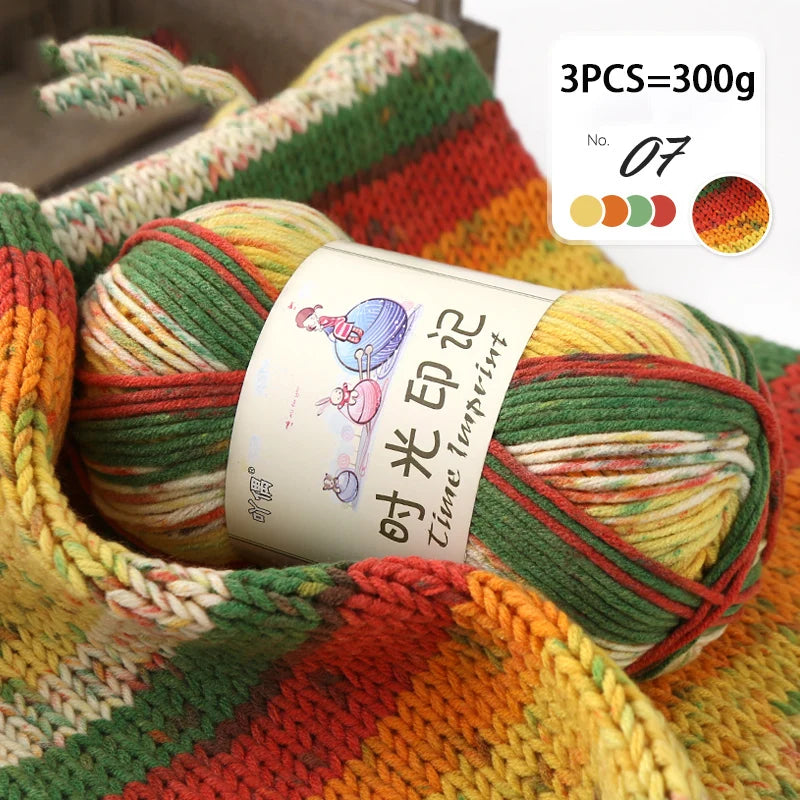 A ball of multi-colored gradient acrylic yarn is shown, packaged as a 3-piece set weighing 300g.