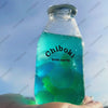 A clear bottle filled with green liquid, labeled Chiboki, resting in an open hand.