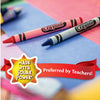 A set of Crayola colored pencils lying on a blue surface with a red ribbon and text indicating they are preferred by teachers