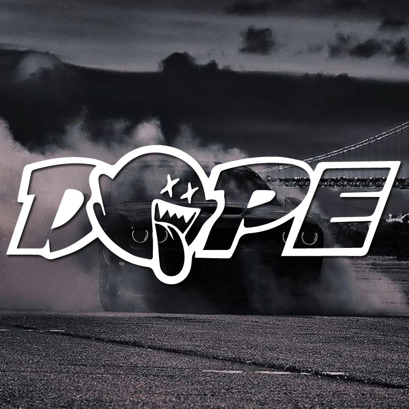 A black car is performing a burnout, with the DOPE decal logo visible in the foreground against a dark, moody background.