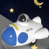 A white and blue soft rubber pull-back toy car is shown against a dark background with a crescent moon and a star.