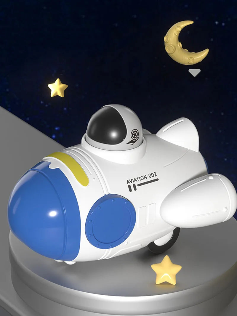 A white and blue soft rubber pull-back toy car is shown against a dark background with a crescent moon and a star.