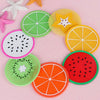 A set of colorful fruit pattern PVC coasters including lime, starfruit, orange, watermelon, and kiwi designs.