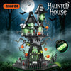 A spooky Halloween haunted house castle kit made of gray and green building blocks under a full moon.