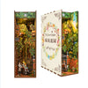 A DIY book nook kit featuring a detailed miniature garden scene with LED lighting and a dust cover.