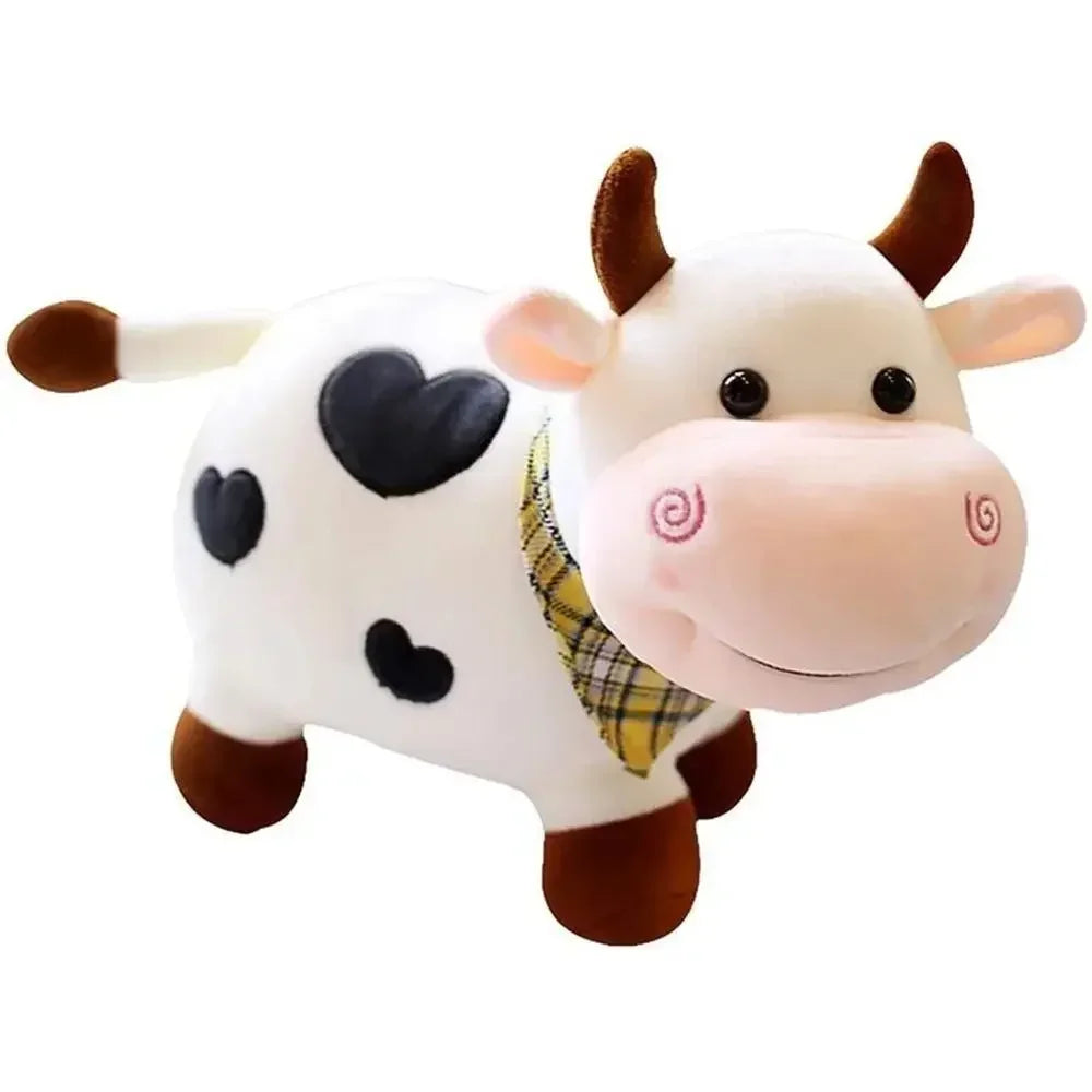 A white and brown cow plush toy with black spots and a yellow plaid collar.