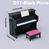 A black piano model with a pink bench and sheet music displayed on a gray background.