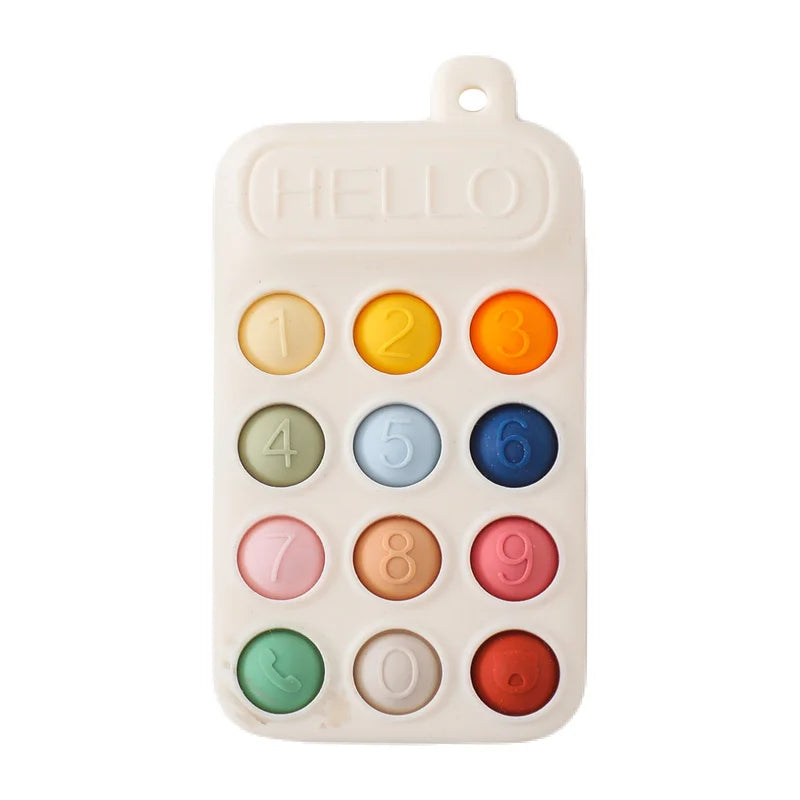 A white silicone baby teether toy with numbered and symbol buttons, featuring a cartoon car design.