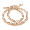 A string of light amber faceted crystal beads used for jewelry making.