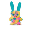 A colorful plush monster resembling a fuggler with large ears and a funny grin.
