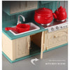 A miniature dollhouse kitchen scene featuring red pots and utensils on a light green countertop.