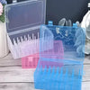 A set of transparent sewing thread organizers in pink and blue plastic with lids, showing various bobbins and compartments.