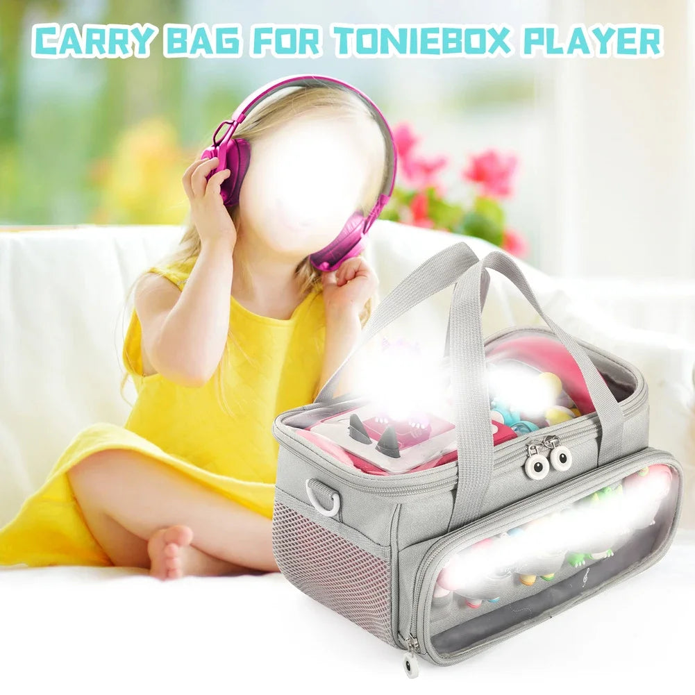 A yellow-clad girl is holding a purple Toniebox player while sitting on a couch, with the travel case lying in front of her.