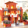 A detailed miniature brick building set simulating a house with architectural coloring and landscaping.