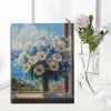 A painting of a bouquet of pink and white flowers on a canvas, featuring a blue background.