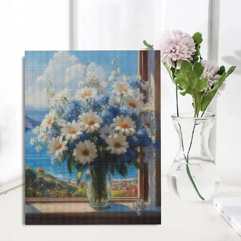 A painting of a bouquet of pink and white flowers on a canvas, featuring a blue background.