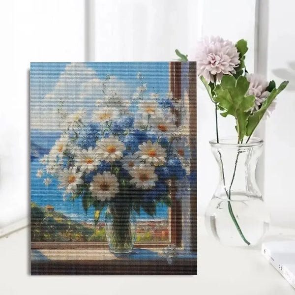 Un tableau de bouquet de fleurs roses et blanches sur fond bleu.