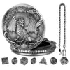 A detailed metal dragon design on a watch case with seven small dice.