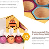A set of three wooden bee trap toys in various colors demonstrating logic and fine motor skills.