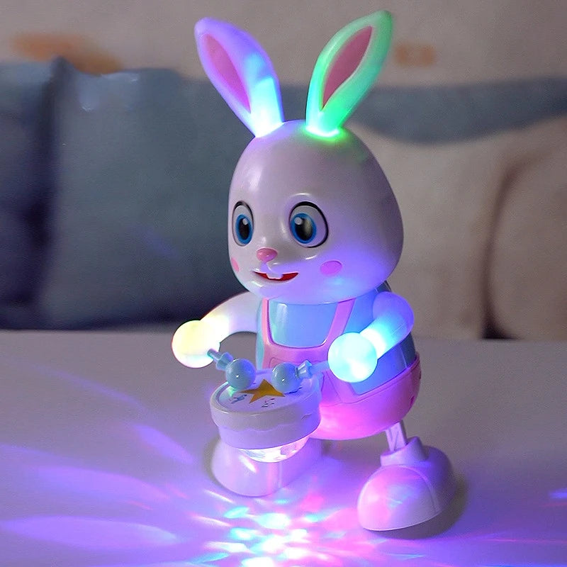 A pink LED bunny toy with glowing eyes and light effects is shown on a white surface.