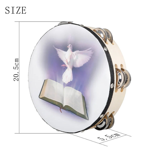 A round, light-colored wooden tambourine with a silver-colored rim and a depiction of a dove and an open book on the face.