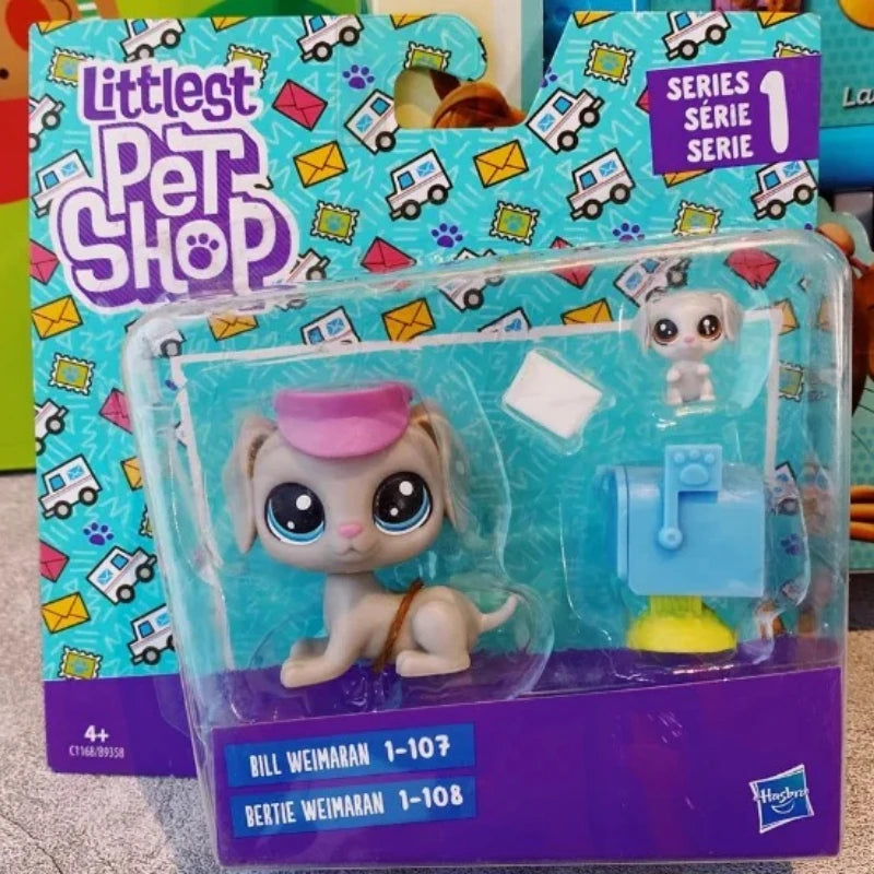 A plastic packaging box for a set of Littlest Pet Shop figures, including a light-colored dog figure and accessories.