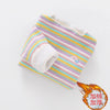 A striped cotton shirt for girls with a floral print detail and a small orange tag.