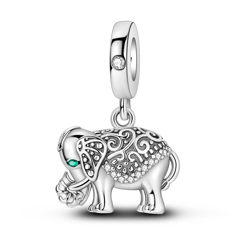 Sterling silver charm featuring an elephant design with a sparkling gemstone pendant.