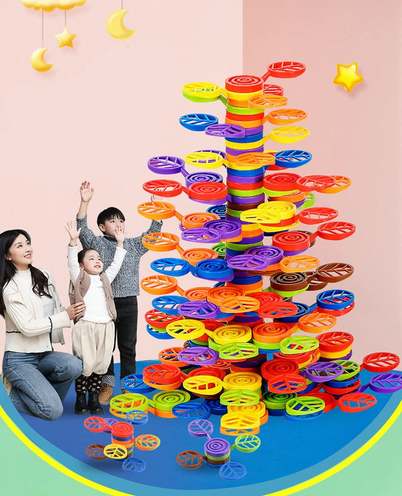 A colorful rainbow balance tree stacking block toy with various colored rings arranged in a vertical structure.