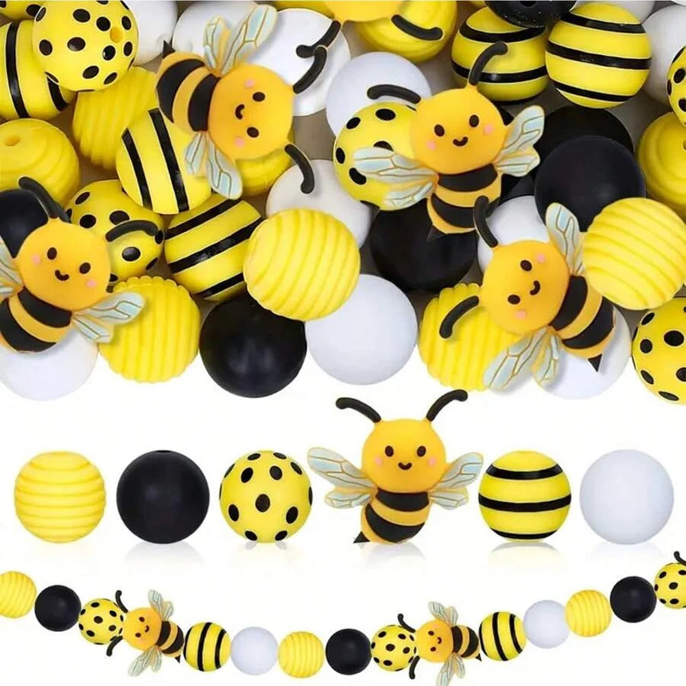 A collection of yellow and black silicone bee beads for DIY crafts.