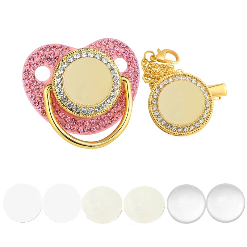 A set of pink and gold rhinestone baby pacifiers and clips with various sizes.