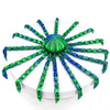 A colorful octopus desktop statue with green and blue tentacles radiating from a central sphere.