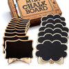 A set of mini wooden chalkboard signs with easels for decor, displayed next to a box of chalk board supplies.
