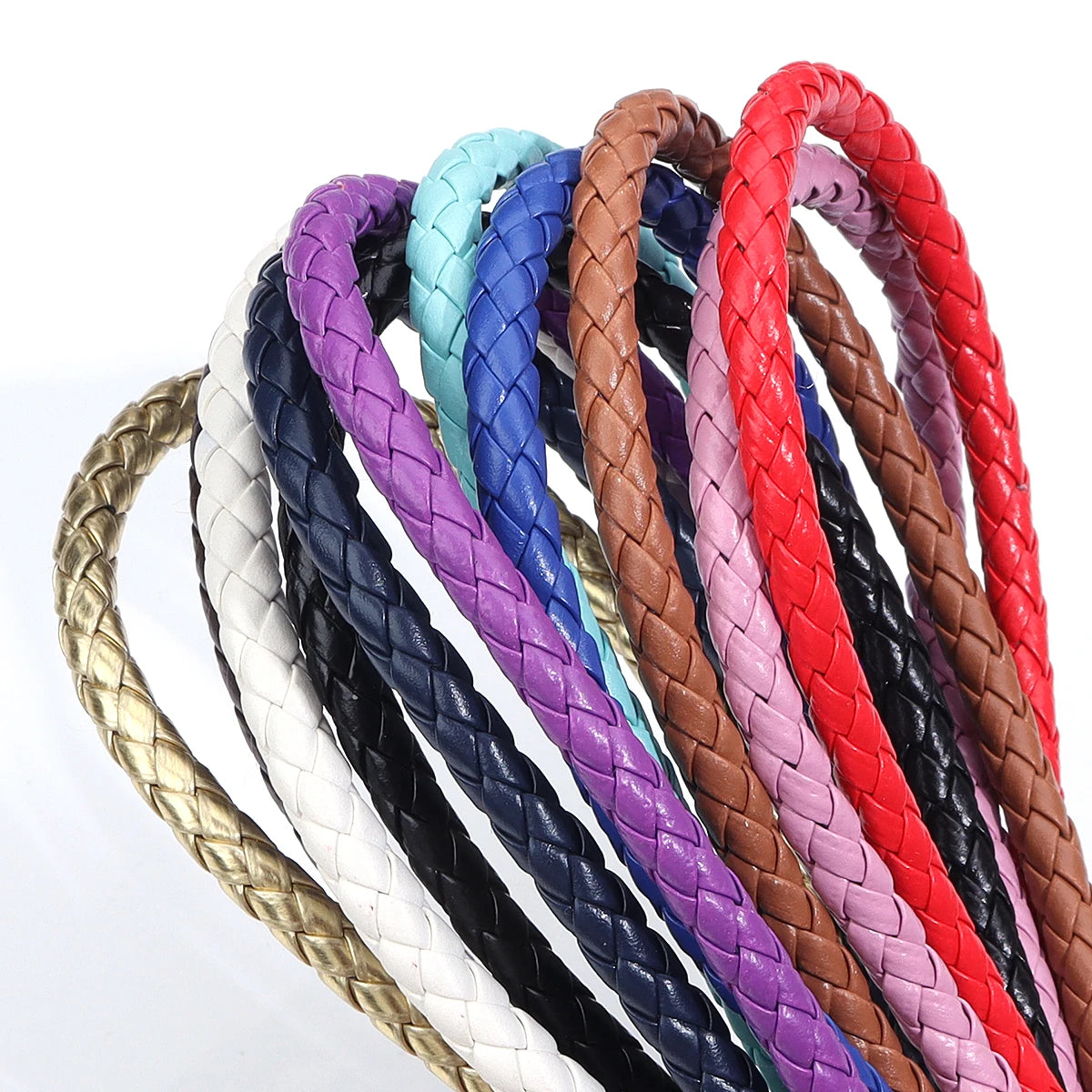 A collection of round braided leather cords in various colors including purple, blue, black, white, and red.