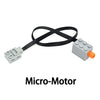 A black micro-motor with a connector and an orange output, used for building blocks.