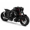 A black vintage die-cast motorcycle model in 1:10 scale shown from the side.
