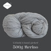 A ball of grey Merino wool yarn, hand-picked and 300g, shown against a dark background.