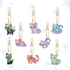 A set of eight DIY animal diamond art keychains featuring various cats in pastel colors and glitter.