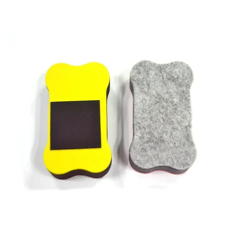 A yellow flexible magnetic dry erase board with a black rectangle and a gray felt board.