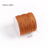 A roll of 0.8mm x 40m orange cotton nylon macrame cord for jewelry making and crafts.