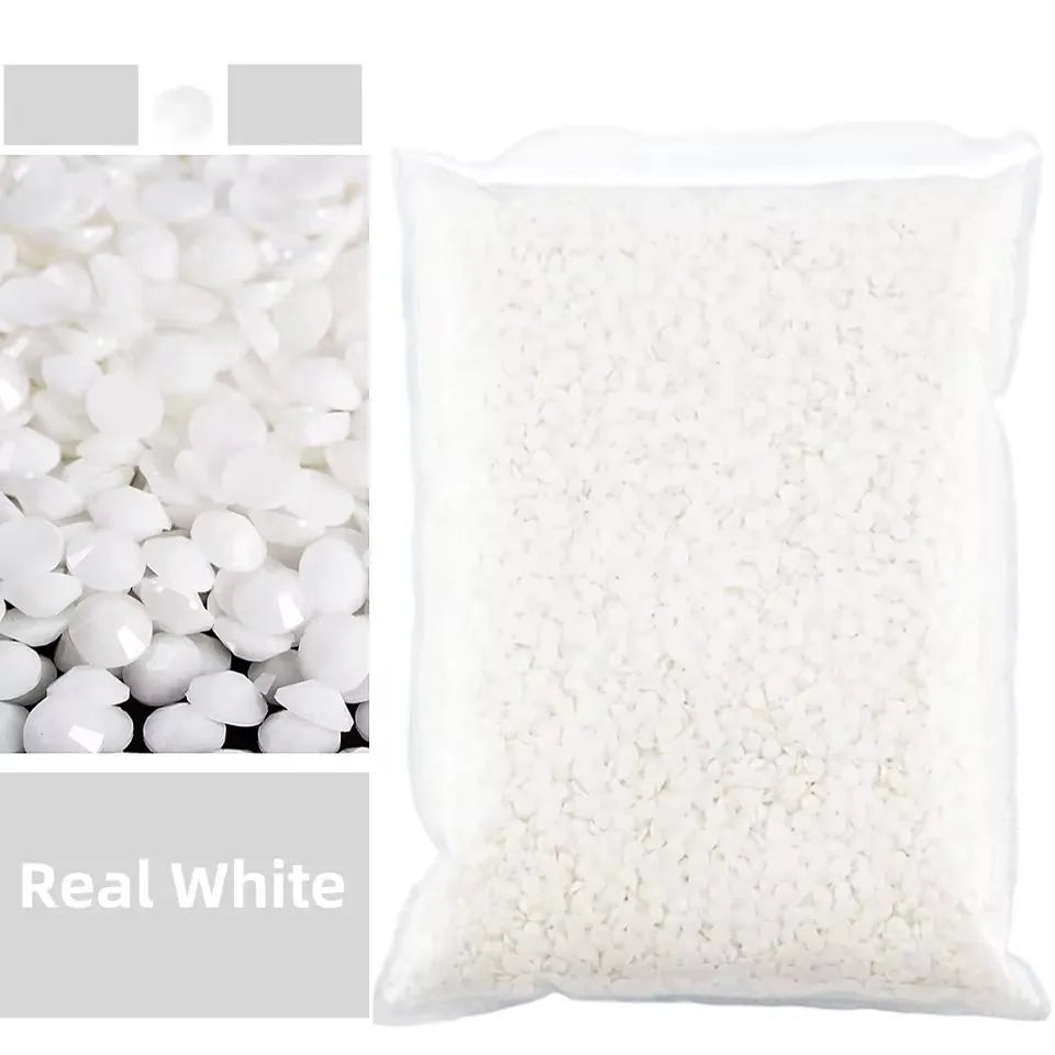 A white bag filled with small, flat resin rhinestones for crafts and DIY projects.