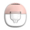 A pink hands-free wearable breast pump with a clear light housing.