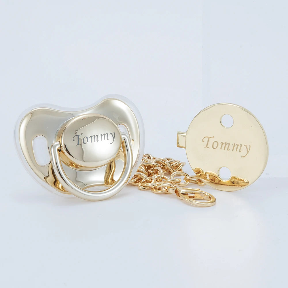Rose gold rhinestone pacifier and clip set with a Tommy charm