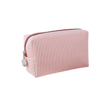 A pink and white striped canvas pencil case with a zipper and a silver charm.